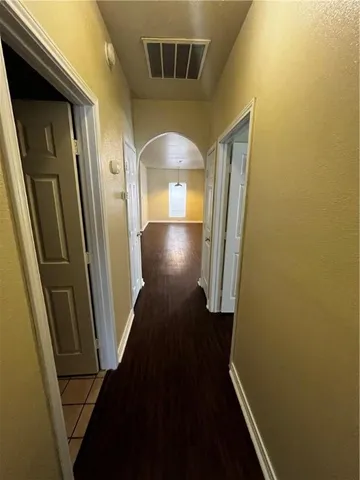 a view of staircase with wooden floor and chair