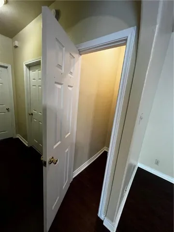 a view of a bathroom from a hallway