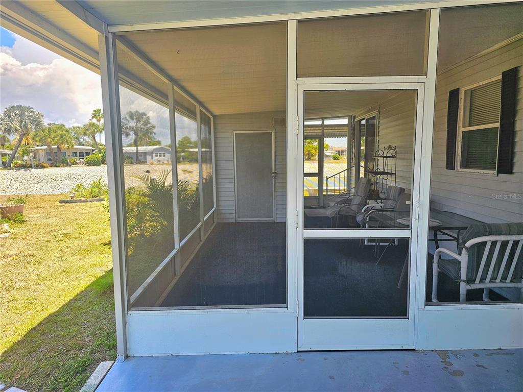 110 Roma Road Venice, FL 34285 - Photo 22 of 45 a view of living room and floor to ceiling window
