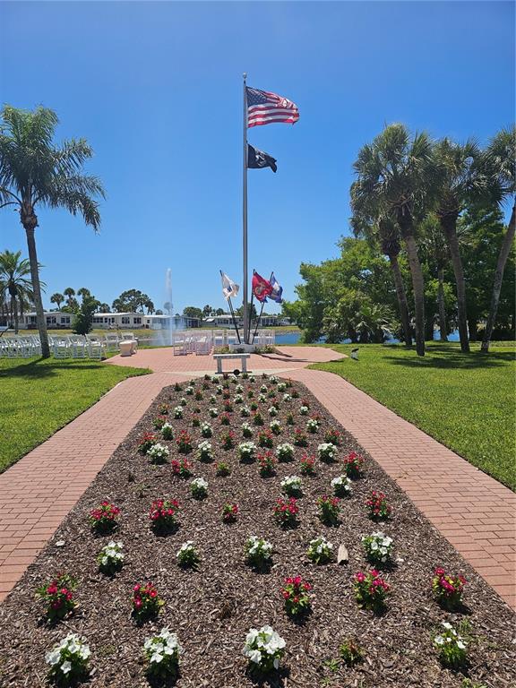 110 Roma Road Venice, FL 34285 - Photo 33 of 45 a view of a backyard with a garden and trees