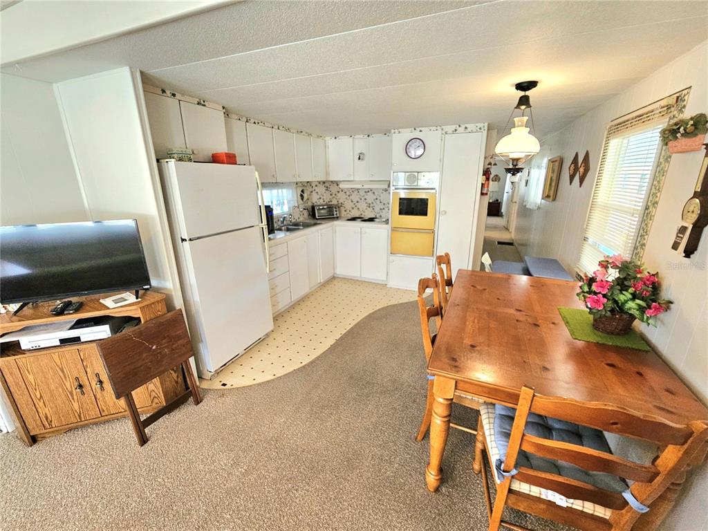 110 Roma Road Venice, FL 34285 - Photo 8 of 45 a living room with furniture and a flat screen tv