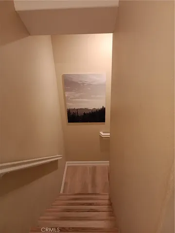 a view of a dining room with furniture and a chandelier