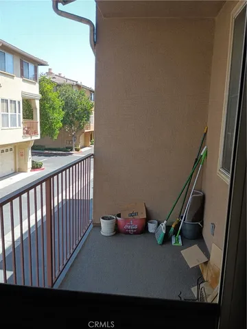 a front view of house with car parked