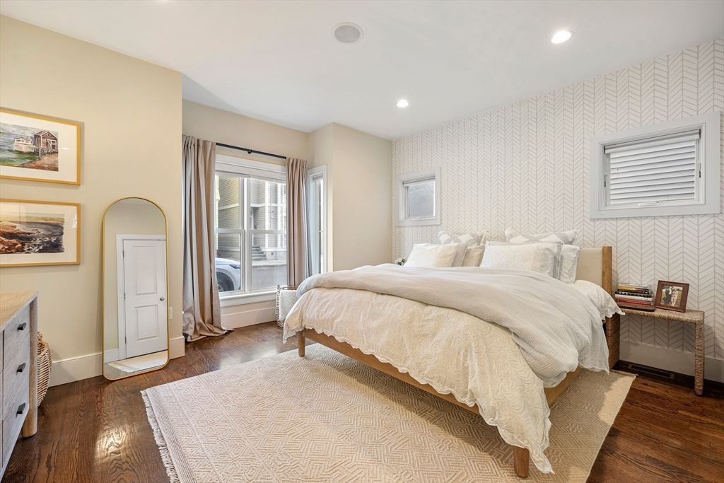 861 East 2nd Street, Unit 1 Boston, MA 02127 - Photo 12 of 30 a spacious bedroom with a large bed and a dresser