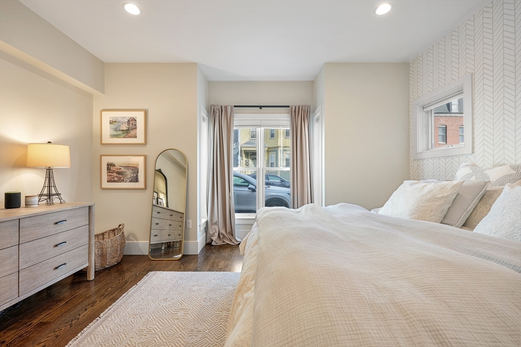 861 East 2nd Street, Unit 1 Boston, MA 02127 - Photo 14 of 30 a bedroom with a bed and a dresser