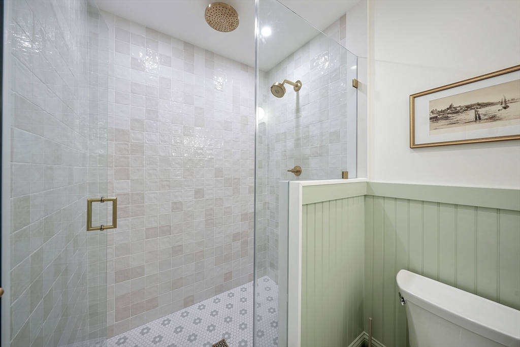 861 East 2nd Street, Unit 1 Boston, MA 02127 - Photo 17 of 30 a bathroom with a shower and a toilet