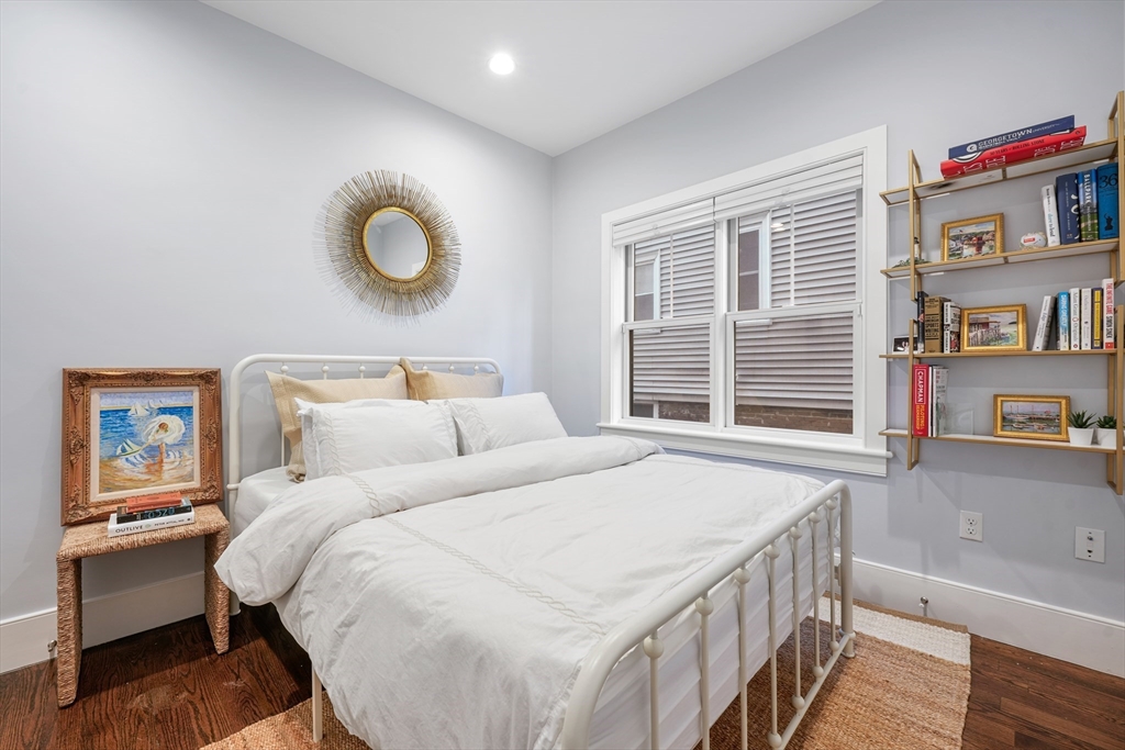 861 East 2nd Street, Unit 1 Boston, MA 02127 - Photo 18 of 30 a bedroom with bed and a large window
