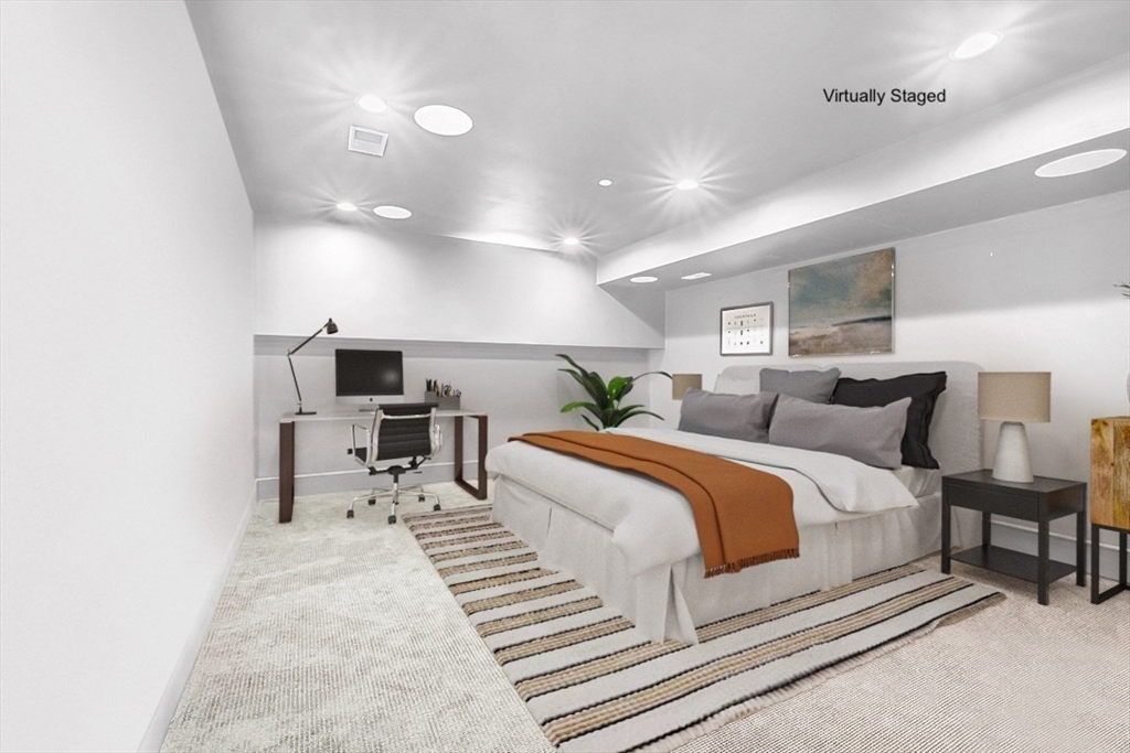 861 East 2nd Street, Unit 1 Boston, MA 02127 - Photo 26 of 30 a spacious bedroom with a bed and a chair