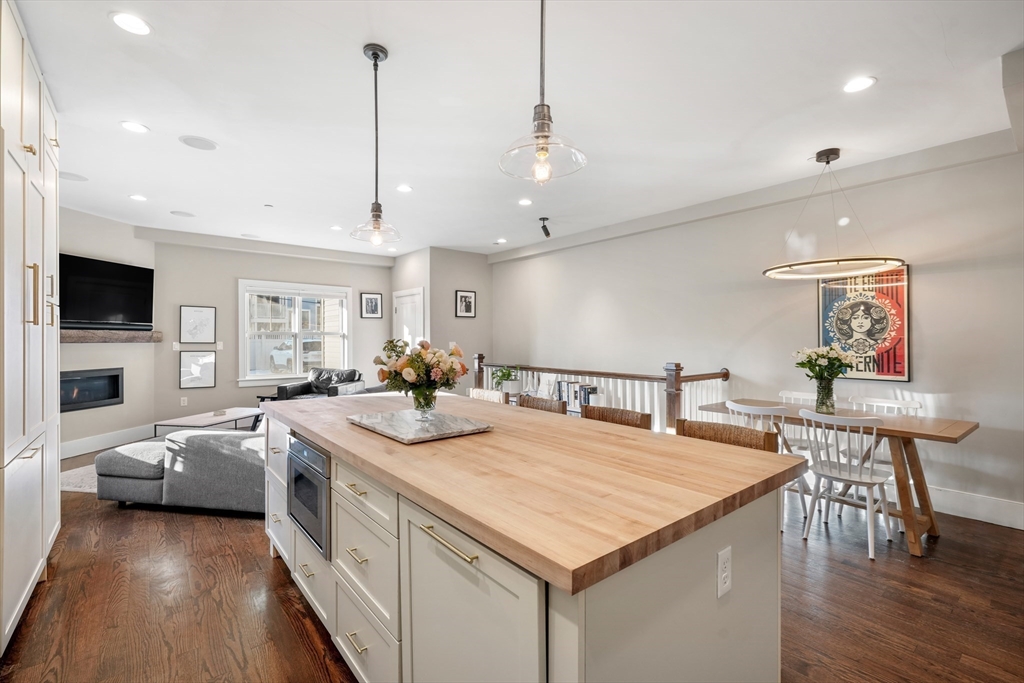 861 East 2nd Street, Unit 1 Boston, MA 02127 - Photo 4 of 30 a kitchen with stainless steel appliances granite countertop a sink a stove and a refrigerator