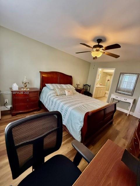 2981 North Nob Hill Road, Unit 306 Sunrise, FL 33322 - Photo 18 of 34 a bedroom with a bed and a chandelier