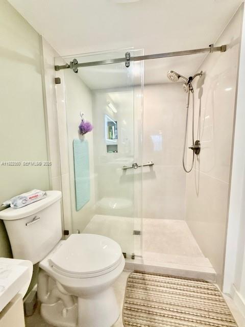 2981 North Nob Hill Road, Unit 306 Sunrise, FL 33322 - Photo 22 of 34 a bathroom with a toilet and a shower