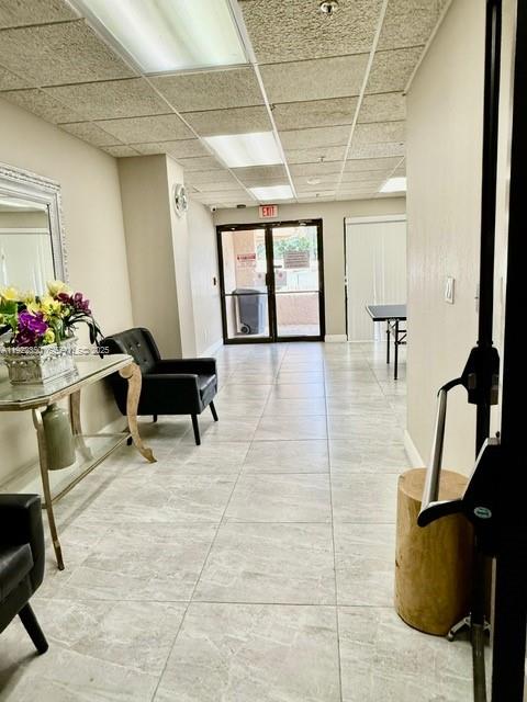 2981 North Nob Hill Road, Unit 306 Sunrise, FL 33322 - Photo 31 of 34 a living room with furniture and a gym machine