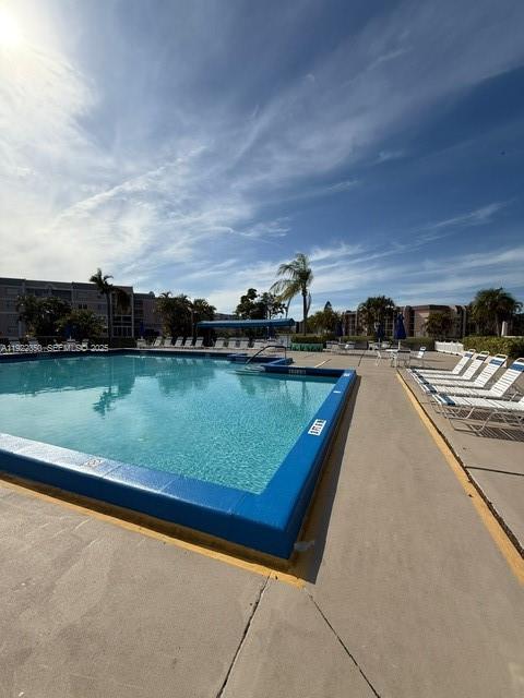 2981 North Nob Hill Road, Unit 306 Sunrise, FL 33322 - Photo 32 of 34 a view of a lake with a city