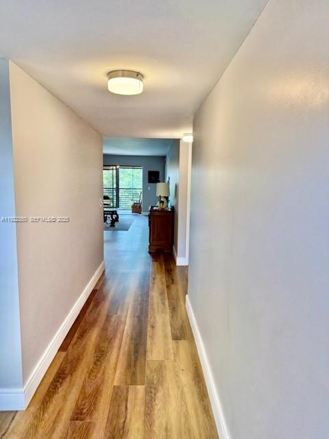 2981 North Nob Hill Road, Unit 306 Sunrise, FL 33322 - Photo 6 of 34 a view of a living room with a wooden floor