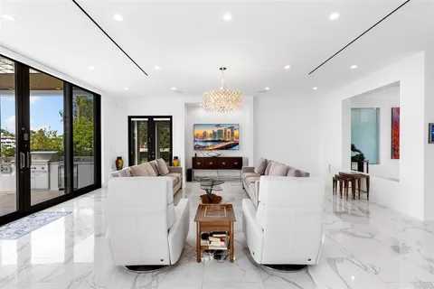 a view of a hallway with wooden floor and entryway