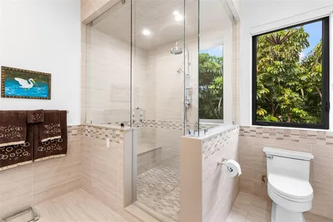 a children room with furniture and wooden floor