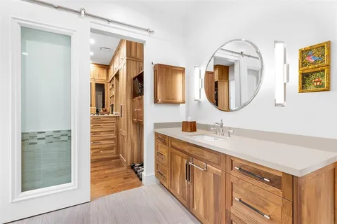 a view of an empty room and wooden floor