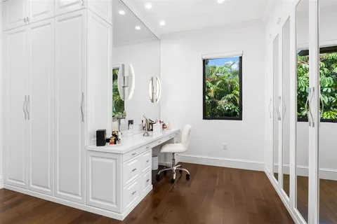 a bathroom with a toilet sink shower and mirror
