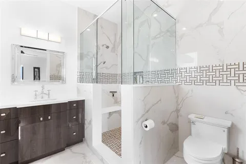 a spacious bedroom with a bed and furniture