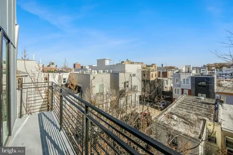 a view of a balcony with city view