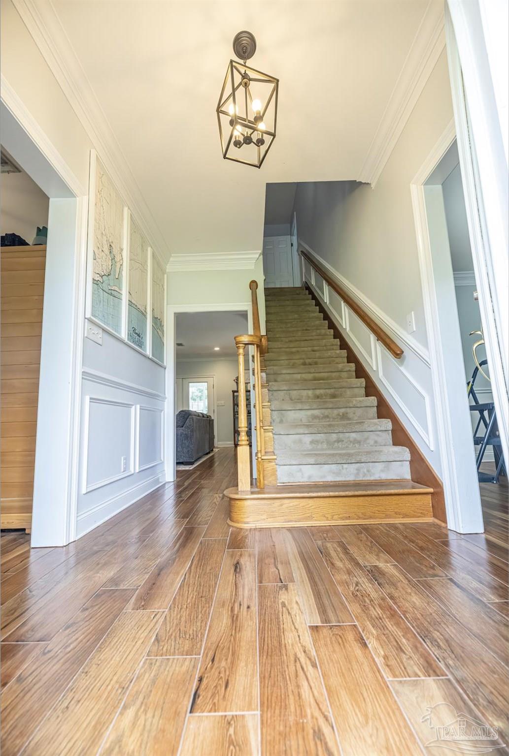 5013 Roland Road Pace, FL 32571 - Photo 6 of 30 a view of a hallway with wooden floor