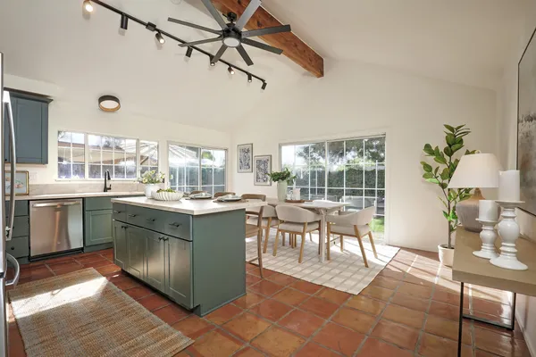 a kitchen with a table and chairs