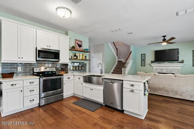 a front view of house with yard and outdoor seating