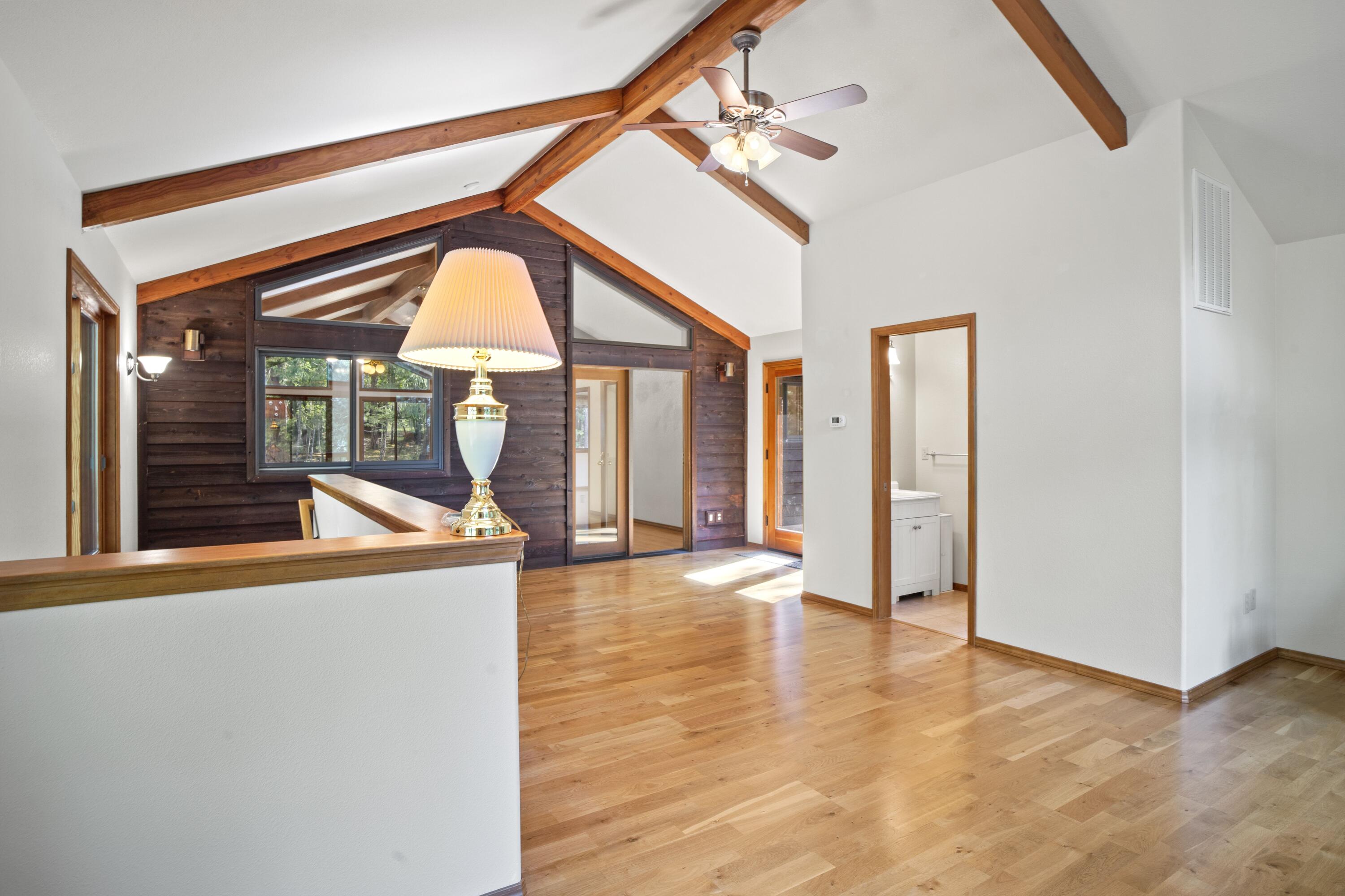 2021 Queens Branch Road Rogue River, OR 97537 - Photo 14 of 37 a view of a room with a large window and wooden floor