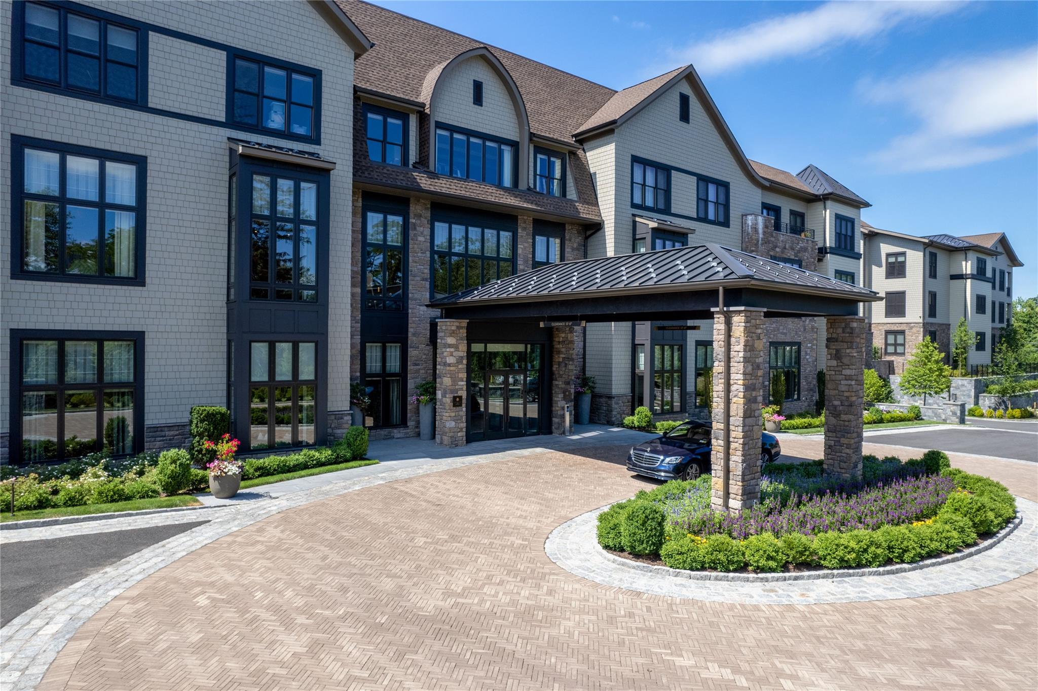 a front view of brick house with a yard
