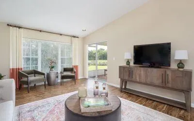 a living room with furniture and a flat screen tv