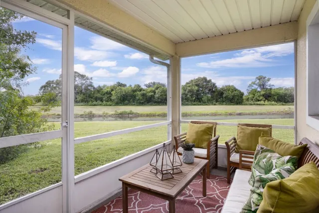 a view of swimming pool with a table and chairs