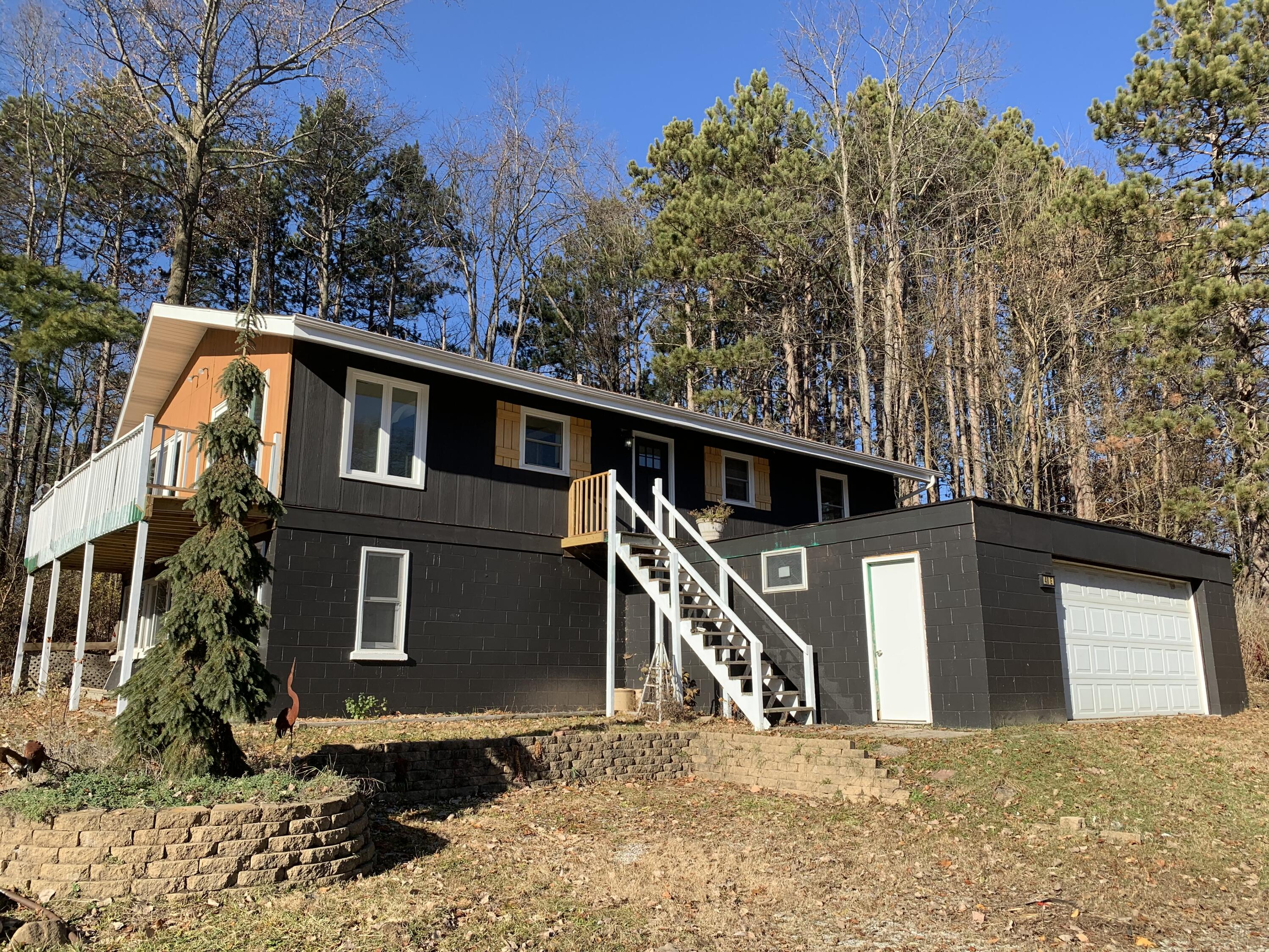 48 East Division Road Valparaiso, IN 46383 - Photo 1 of 13 a backyard of a house with large trees