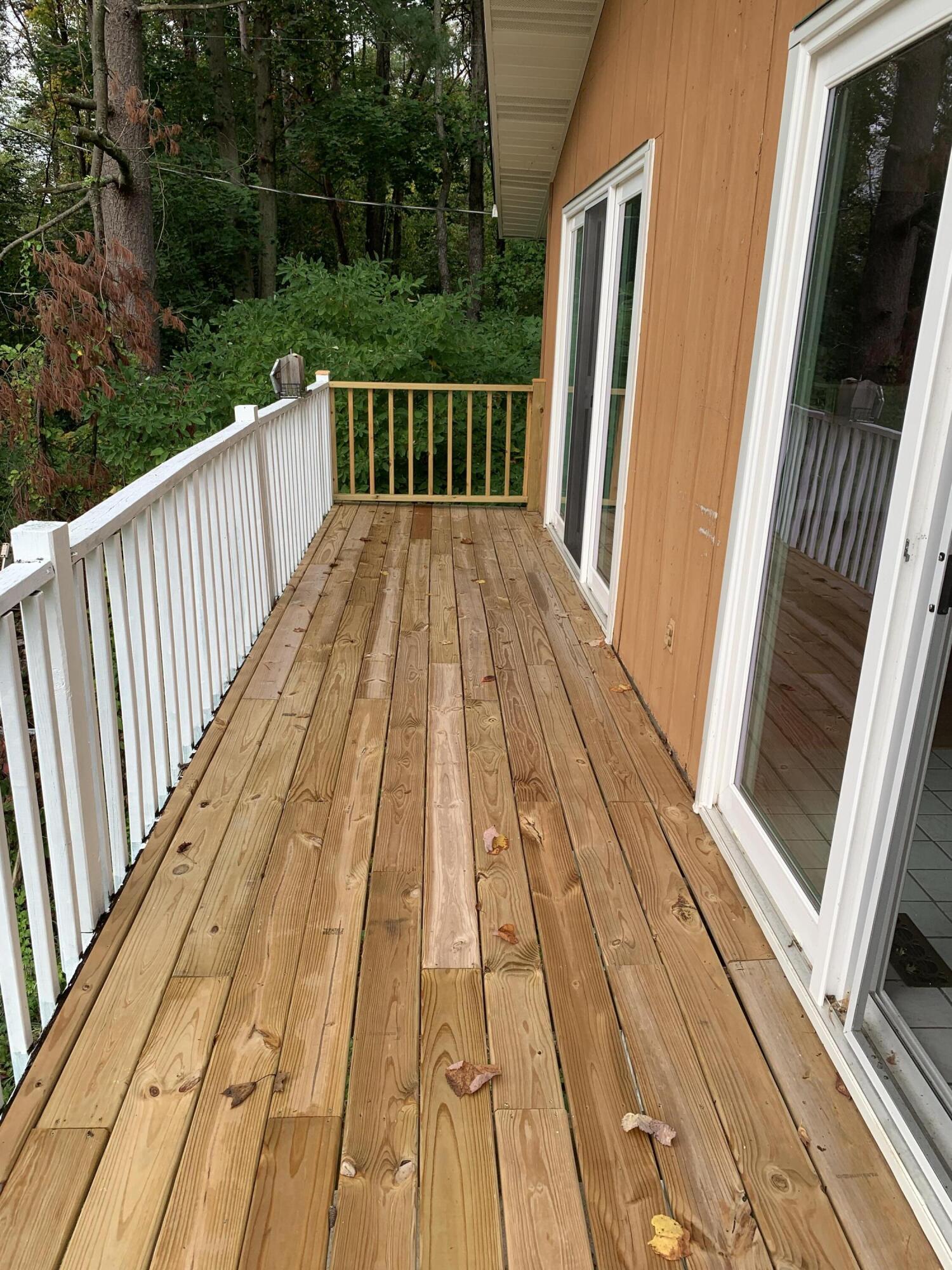 48 East Division Road Valparaiso, IN 46383 - Photo 12 of 13 a view of balcony with wooden floor and fence