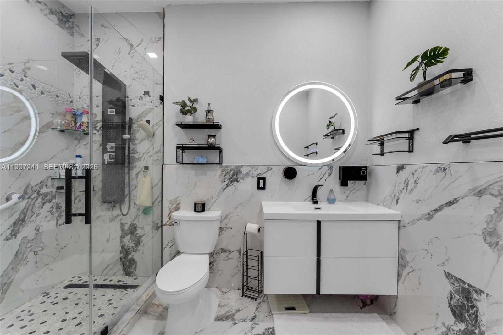 13240 Southwest 274th Street Homestead, FL 33032 - Photo 21 of 54 a bathroom with a sink a toilet and a mirror