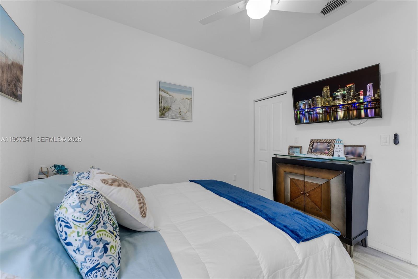 13240 Southwest 274th Street Homestead, FL 33032 - Photo 23 of 54 a bedroom with bed and a flat screen tv