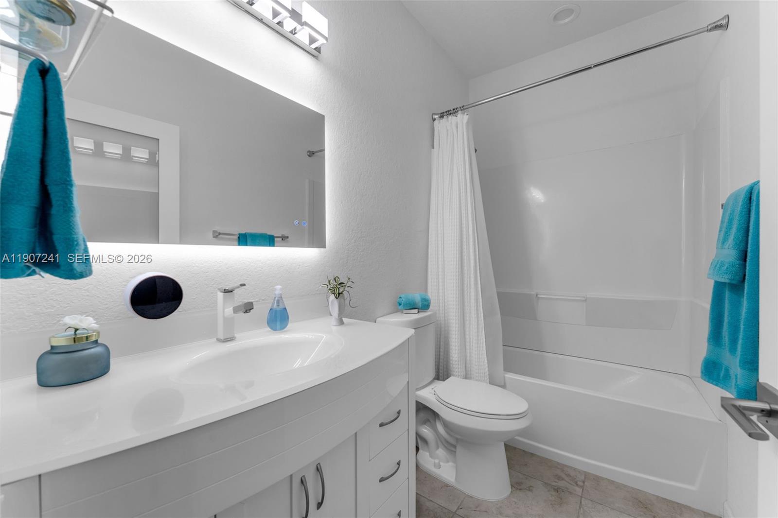 13240 Southwest 274th Street Homestead, FL 33032 - Photo 24 of 54 a bathroom with a sink a toilet and a mirror