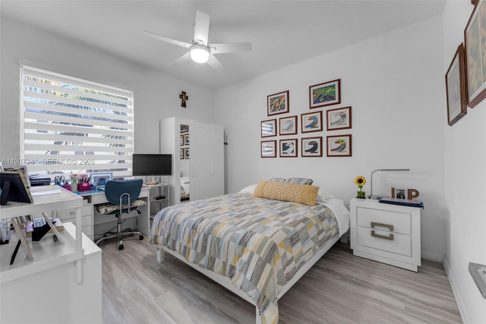 13240 Southwest 274th Street Homestead, FL 33032 - Photo 25 of 54 a bedroom with a bed furniture and a window