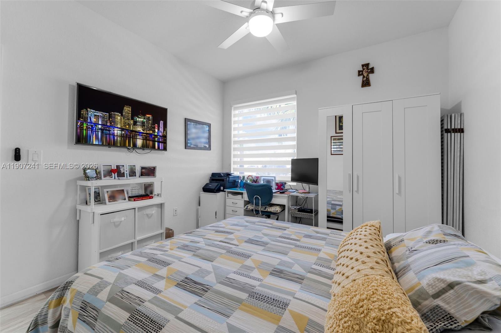 13240 Southwest 274th Street Homestead, FL 33032 - Photo 26 of 54 a bedroom with a bed and a flat screen tv