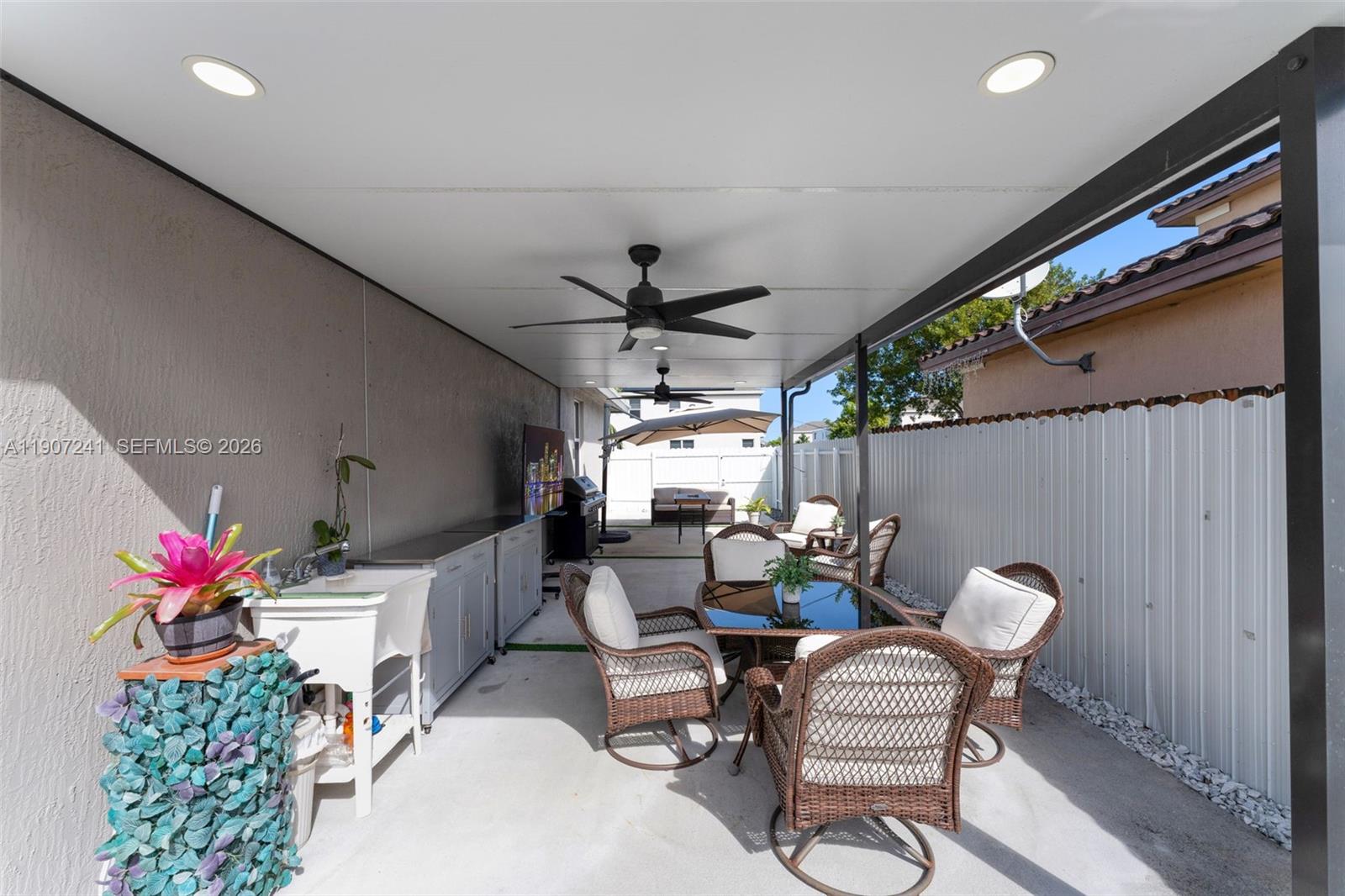13240 Southwest 274th Street Homestead, FL 33032 - Photo 30 of 54 a living room with furniture and a potted plant