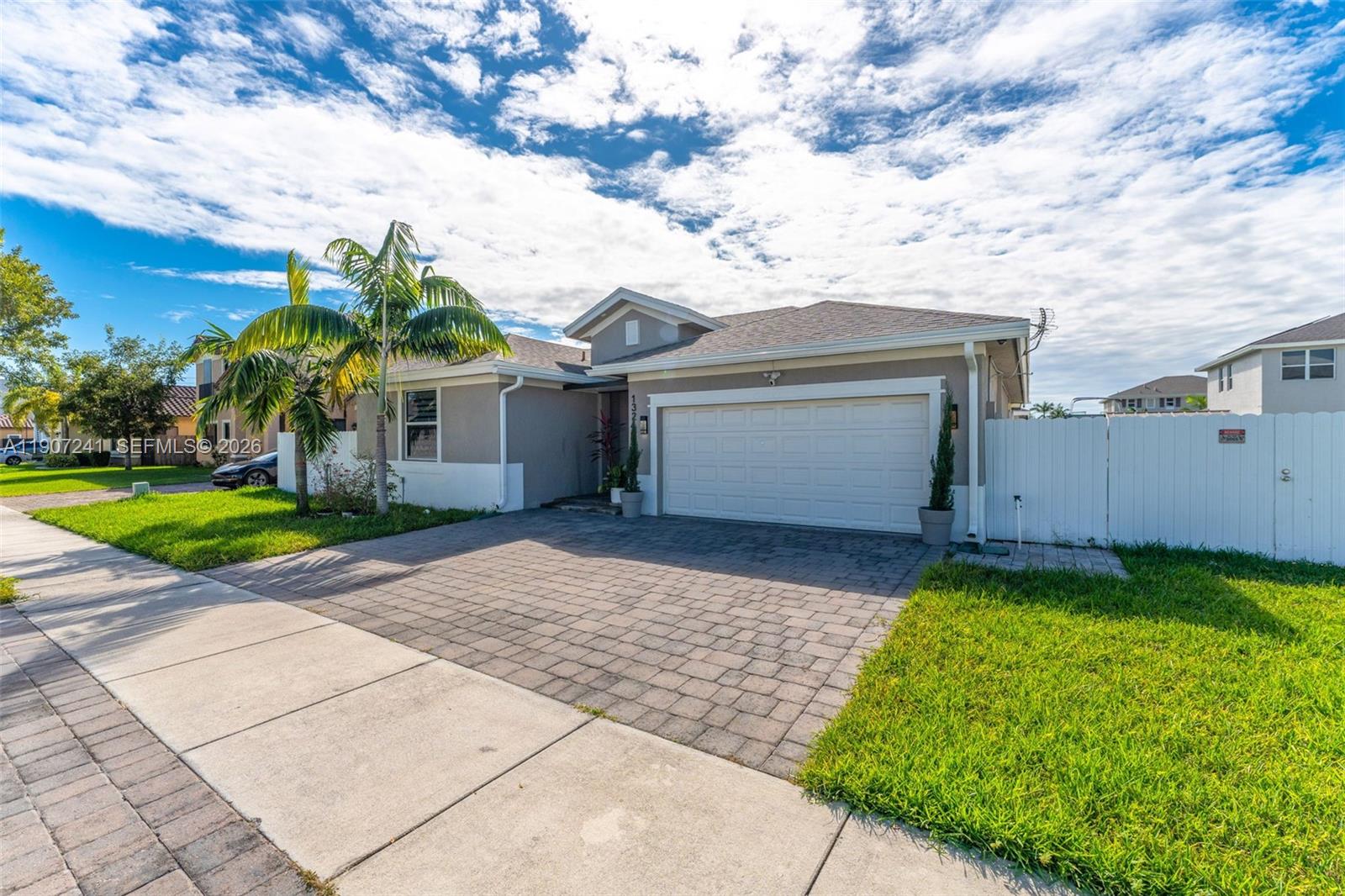 13240 Southwest 274th Street Homestead, FL 33032 - Photo 4 of 54 a front view of house with a garden
