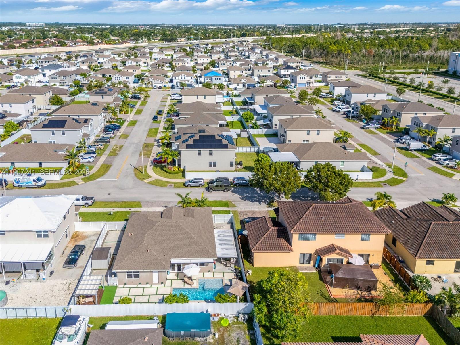 13240 Southwest 274th Street Homestead, FL 33032 - Photo 46 of 54 an aerial view of residential houses with outdoor space