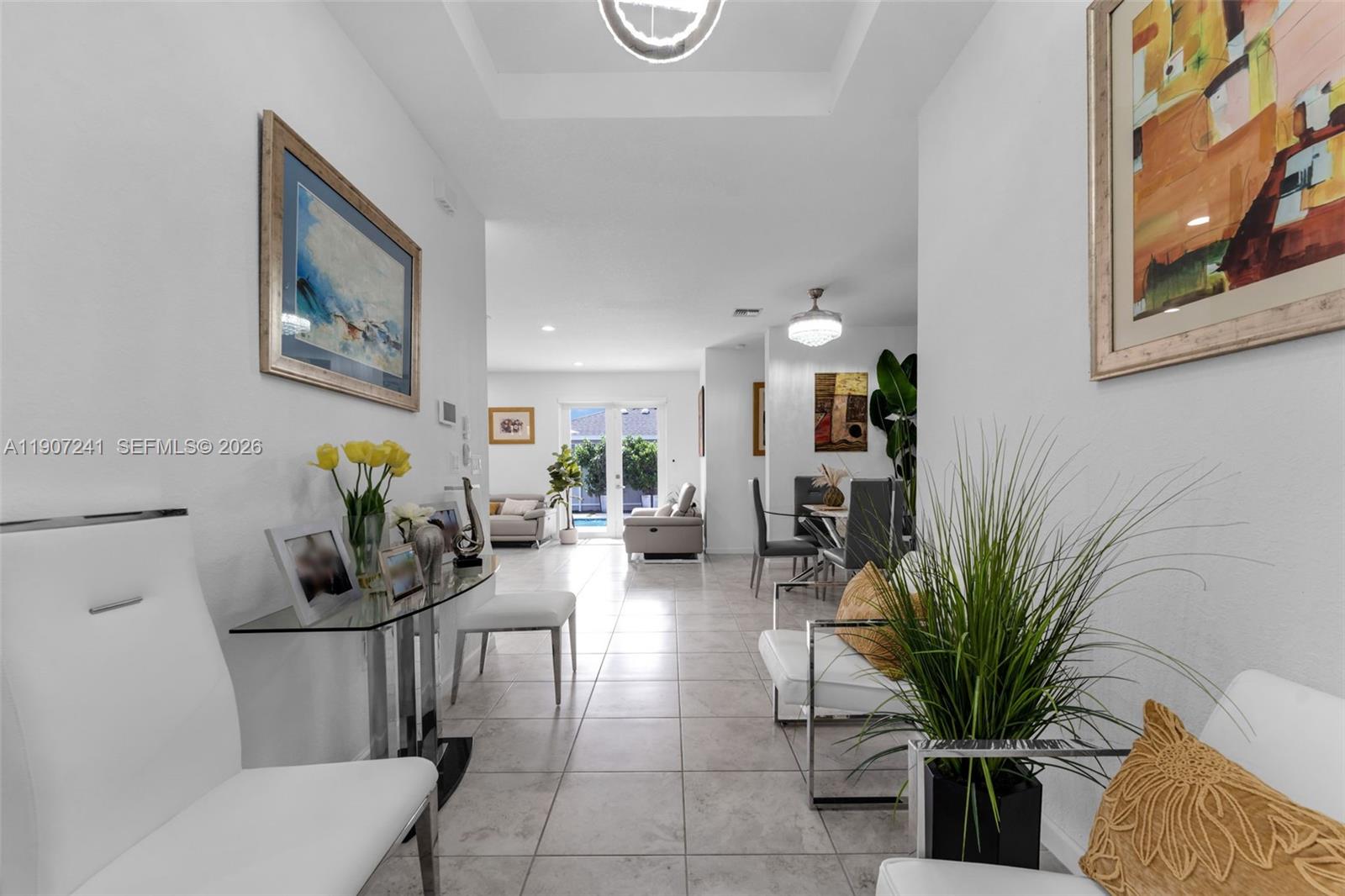 13240 Southwest 274th Street Homestead, FL 33032 - Photo 7 of 54 a living room with furniture flowerpot and a potted plant