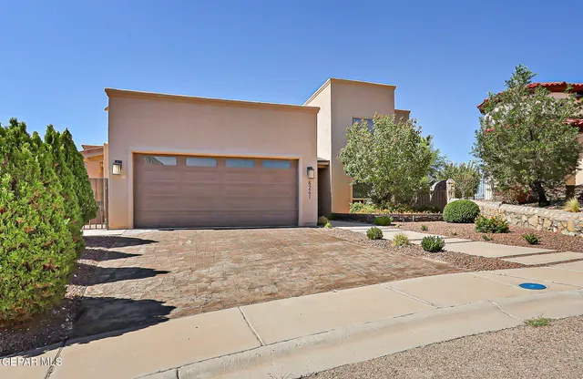a backyard of a house with yard and garage