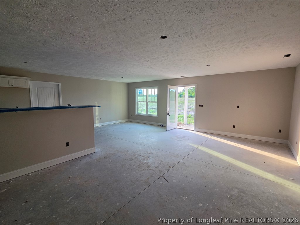 756 Jordan Road Autryville, NC 28318 - Photo 10 of 34 a view of an empty room with a window