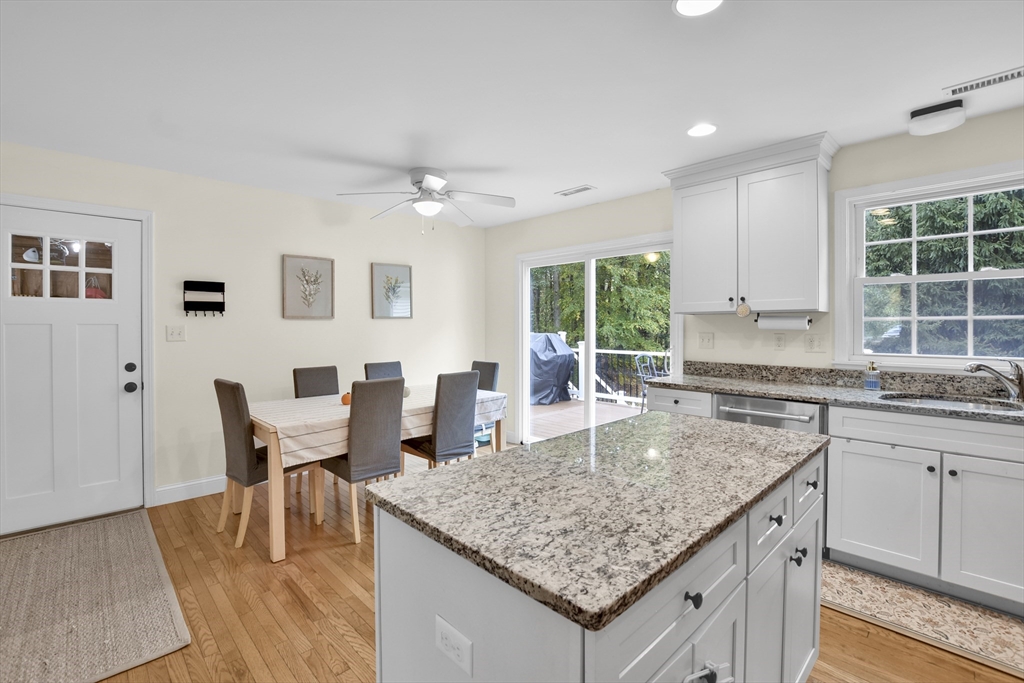 503 South Meadow Road Lancaster, MA 01523 - Photo 6 of 26 a kitchen with granite countertop kitchen island a table and chairs in it