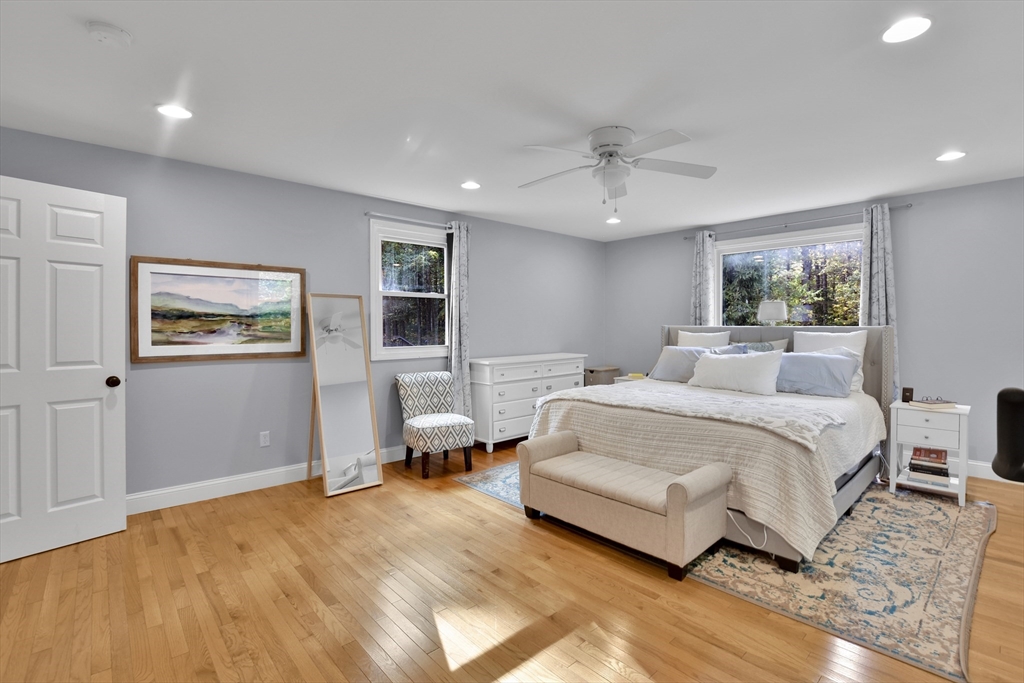 503 South Meadow Road Lancaster, MA 01523 - Photo 8 of 26 a spacious bedroom with a bed and a couch