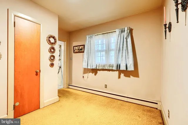 a kitchen with a refrigerator a sink dishwasher a stove and a refrigerator with wooden cabinets