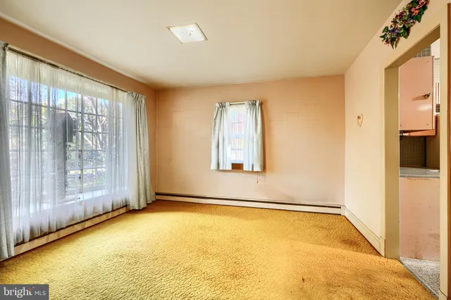 a large white kitchen with a window