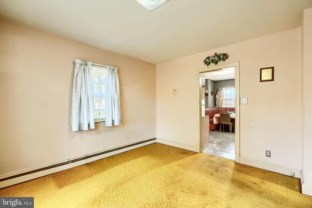 a bathroom with a sink a toilet and a shower curtain