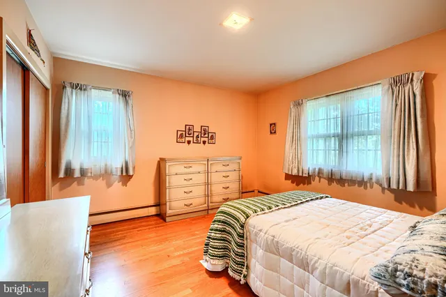 a view of an empty room with a fireplace